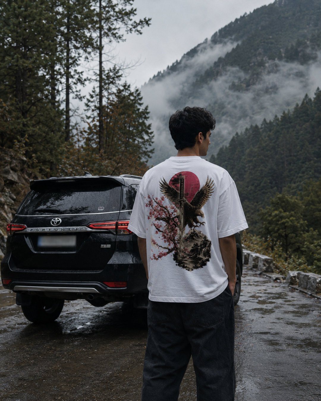 Katana oversized tee lifestyle shot on a mountain road