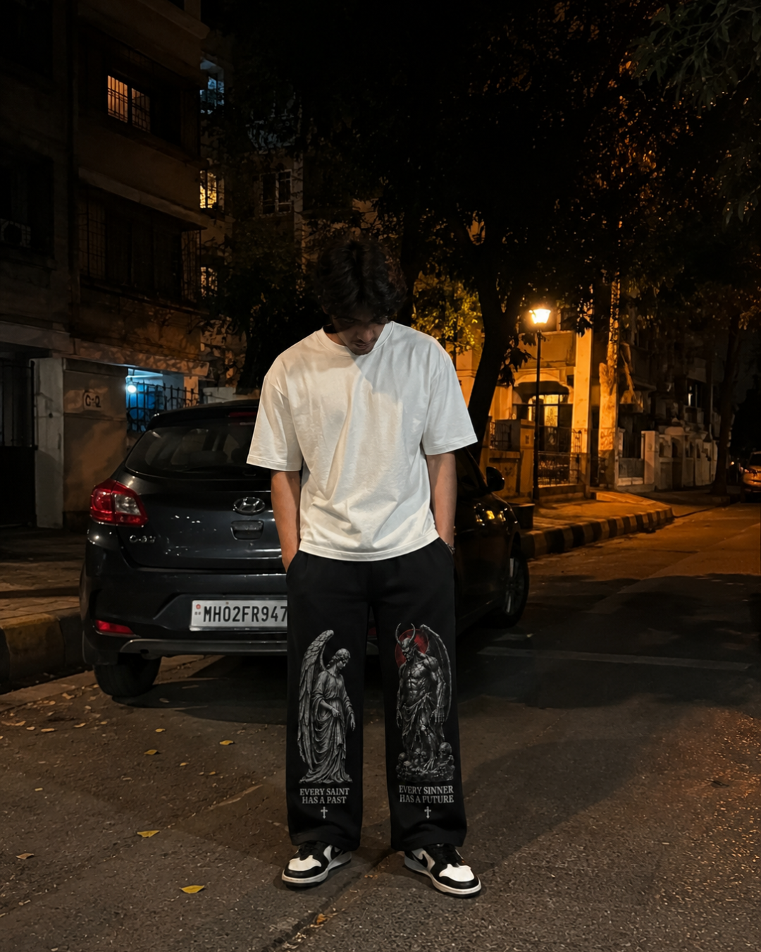 Saint & Sinner black trackpants lifestyle shot